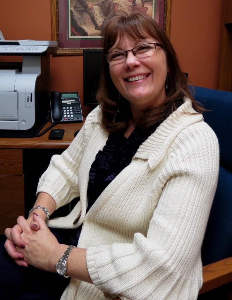 Professor Linda Taylor sitting in the PWR office.